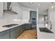 Modern kitchen with stainless steel appliances and gray cabinets at 26123 N 20Th Dr, Phoenix, AZ 85085