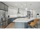 Modern kitchen with gray cabinets, white countertops, and stainless steel appliances at 26123 N 20Th Dr, Phoenix, AZ 85085