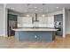 Modern kitchen with white and gray cabinets and herringbone backsplash at 26123 N 20Th Dr, Phoenix, AZ 85085