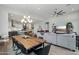 Modern kitchen with island and adjacent dining area at 26123 N 20Th Dr, Phoenix, AZ 85085