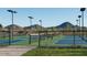 Well-lit pickleball courts with mountain backdrop at 26123 N 20Th Dr, Phoenix, AZ 85085