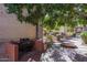 Community BBQ grilling station with brick pavers and lush landscaping at 3031 N Civic Center Plz # 228, Scottsdale, AZ 85251