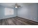 Bright bedroom with ceiling fan and wood-look floors at 3031 N Civic Center Plz # 228, Scottsdale, AZ 85251