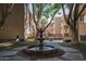 Charming courtyard with a tiered fountain and a peaceful walkway at 3031 N Civic Center Plz # 228, Scottsdale, AZ 85251