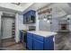 Modern kitchen with blue cabinets and stainless steel appliances at 3031 N Civic Center Plz # 228, Scottsdale, AZ 85251