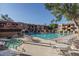 Community pool with spa and lounge chairs at 3031 N Civic Center Plz # 228, Scottsdale, AZ 85251