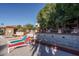 Pool area with colorful lounge chairs and a water feature at 3031 N Civic Center Plz # 228, Scottsdale, AZ 85251