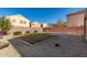 Large backyard with grassy area and patio at 3104 W Carlos Ln, San Tan Valley, AZ 85144