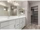 Bathroom boasts double vanity, large mirror, and linen closet at 3104 W Carlos Ln, San Tan Valley, AZ 85144