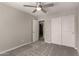 Spacious bedroom with double door closet and ceiling fan at 3104 W Carlos Ln, San Tan Valley, AZ 85144