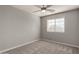 Well-lit bedroom with carpeted floor and ceiling fan at 3104 W Carlos Ln, San Tan Valley, AZ 85144