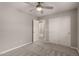 Well-lit bedroom featuring carpet flooring, double door closet and additional access at 3104 W Carlos Ln, San Tan Valley, AZ 85144