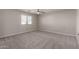 Well-lit bedroom with carpeted floor and window blinds at 3104 W Carlos Ln, San Tan Valley, AZ 85144