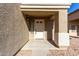 White front door with sidelight and small covered porch at 3104 W Carlos Ln, San Tan Valley, AZ 85144