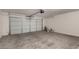 Garage with concrete floor, automatic door, and ample storage at 3104 W Carlos Ln, San Tan Valley, AZ 85144