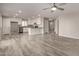 Open kitchen with white cabinets, granite counters, and stainless steel appliances at 3104 W Carlos Ln, San Tan Valley, AZ 85144