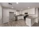 Modern kitchen with white cabinets, granite counters, and stainless steel appliances at 3104 W Carlos Ln, San Tan Valley, AZ 85144