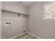 Laundry room with shelving and vinyl flooring at 3104 W Carlos Ln, San Tan Valley, AZ 85144