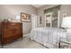 Well-lit bedroom with a dresser and window seat at 31847 N 53Rd St, Cave Creek, AZ 85331