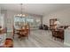 Bright dining area with wood table and chairs, hardwood floors, and natural light at 31847 N 53Rd St, Cave Creek, AZ 85331