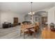 Open dining area with wood table and chairs, hardwood floors, and access to living room at 31847 N 53Rd St, Cave Creek, AZ 85331