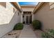 Front entry with double doors and decorative landscaping at 31847 N 53Rd St, Cave Creek, AZ 85331