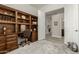 Home office with built-in wooden shelving and desk at 31847 N 53Rd St, Cave Creek, AZ 85331