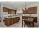 Spacious kitchen with island, granite countertops, and dark wood cabinets at 31847 N 53Rd St, Cave Creek, AZ 85331