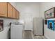 Laundry room with washer, dryer, and cabinets at 31847 N 53Rd St, Cave Creek, AZ 85331