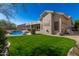 Relaxing backyard oasis with a sparkling pool and grassy area at 31847 N 53Rd St, Cave Creek, AZ 85331