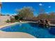 Freeform pool with a waterfall and ample surrounding space at 31847 N 53Rd St, Cave Creek, AZ 85331