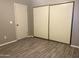 Bedroom with double sliding closet doors and additional door at 3329 W Mcrae Way # 4, Phoenix, AZ 85027