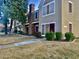 Two-story tan home with a red door and landscaping at 3329 W Mcrae Way # 4, Phoenix, AZ 85027