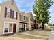 View of tan townhomes with maroon accents at 3329 W Mcrae Way # 4, Phoenix, AZ 85027