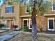 Tan two-story home with red door and landscaping at 3329 W Mcrae Way # 4, Phoenix, AZ 85027