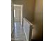 Hallway with gray walls, wood-look flooring, and access to bedroom and stairs at 3329 W Mcrae Way # 4, Phoenix, AZ 85027