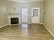 Living room with wood-look floors and a fireplace at 3329 W Mcrae Way # 4, Phoenix, AZ 85027