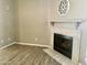 Living room with wood-look floors and a fireplace at 3329 W Mcrae Way # 4, Phoenix, AZ 85027