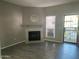 Living room with fireplace, grey walls and wood-look floors at 3329 W Mcrae Way # 4, Phoenix, AZ 85027