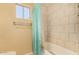 Bathroom with a shower/tub and tile surround at 3519 W Emig Rd, Phoenix, AZ 85053