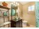 Bathroom features a glass vessel sink and dark vanity at 3519 W Emig Rd, Phoenix, AZ 85053