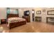 Bedroom with double sinks, a walk-in closet, and wood flooring at 3519 W Emig Rd, Phoenix, AZ 85053