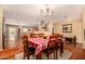 Dining area with hardwood floors and a view of the living room at 3519 W Emig Rd, Phoenix, AZ 85053