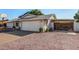 House exterior showcasing a two-car garage and gated side yard at 3519 W Emig Rd, Phoenix, AZ 85053