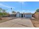 Large backyard with a patio and ample space for outdoor activities at 3740 W Denton Ln, Phoenix, AZ 85019