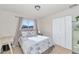 Well-lit bedroom featuring a queen-size bed and built-in wardrobe at 3740 W Denton Ln, Phoenix, AZ 85019