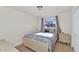 Cozy bedroom with a double bed and window providing natural light at 3740 W Denton Ln, Phoenix, AZ 85019