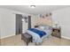 Bright bedroom with a comfortable bed and ample closet space at 3740 W Denton Ln, Phoenix, AZ 85019