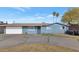 Ranch style home with a single car garage and landscaped front yard at 3740 W Denton Ln, Phoenix, AZ 85019