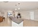 Open concept kitchen with island and granite countertops at 3740 W Denton Ln, Phoenix, AZ 85019